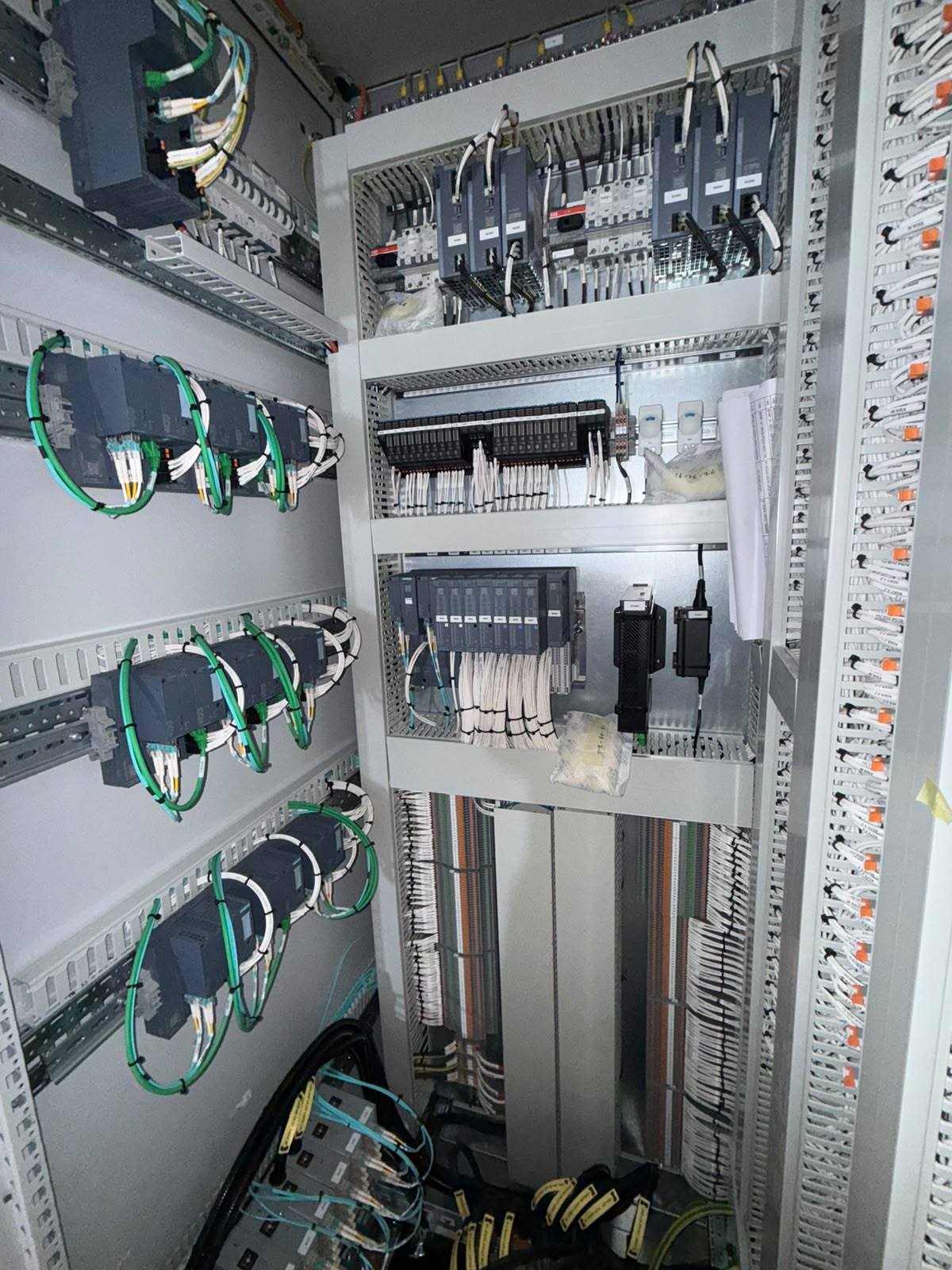 Siemens PLC control cabinet with SCALANCE network switches on the door, fibre optic and PROFINET cabling